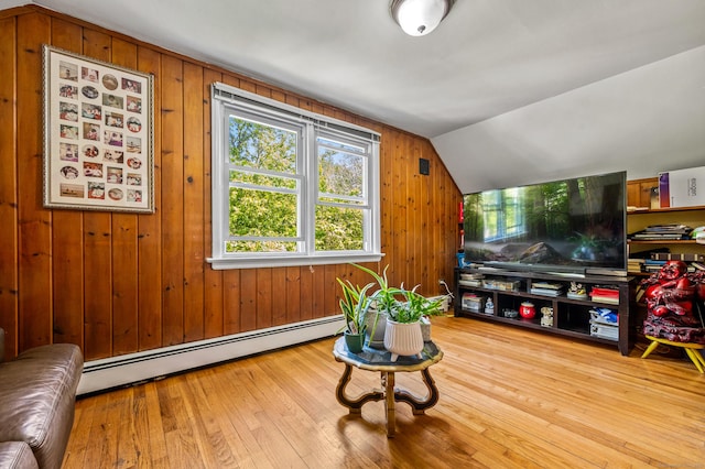 54 Swampscott Rd, Stamford, CT 06905 - living room featuring a baseboard radiator, vaulted ceiling, hardwood / wood-style flooring, and wooden walls