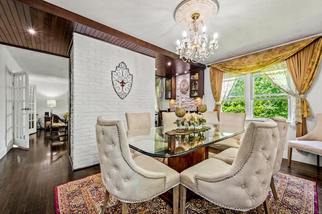 54 Swampscott Rd, Stamford, CT 06905 - dining space with a chandelier, dark wood-style flooring, and baseboards