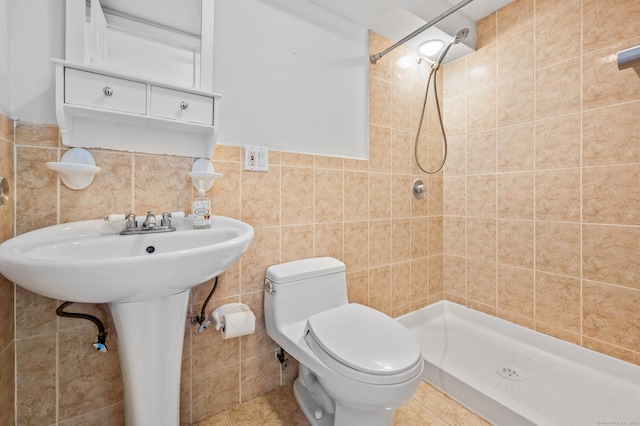 54 Swampscott Rd, Stamford, CT 06905 - full bathroom featuring tile walls, a shower stall, toilet, and tile patterned floors