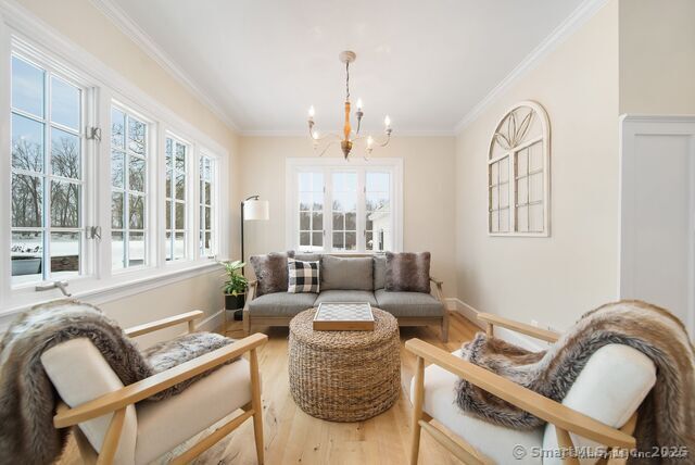 879 Russell Ave, Suffield, CT 06078 - sunroom / solarium with french doors and a chandelier