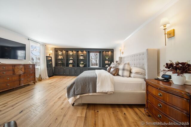 879 Russell Ave, Suffield, CT 06078 - bedroom with ornamental molding and wood finished floors