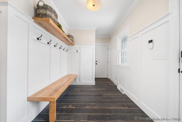 879 Russell Ave, Suffield, CT 06078 - mudroom with ornamental molding and dark wood-style flooring