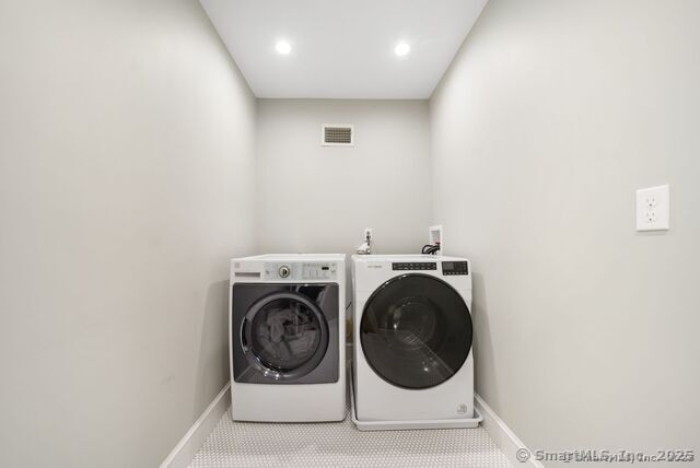 879 Russell Ave, Suffield, CT 06078 - clothes washing area featuring washing machine and dryer, baseboards, recessed lighting, and carpet flooring