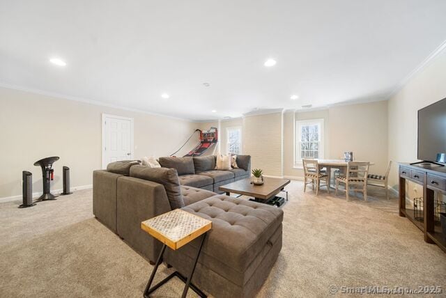 879 Russell Ave, Suffield, CT 06078 - living area featuring crown molding, light colored carpet, recessed lighting, and baseboards
