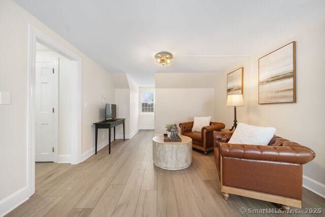879 Russell Ave, Suffield, CT 06078 - living room with wood finished floors and baseboards