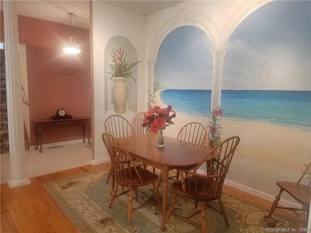 45 Kuhr Dr, Southington, CT 06489 - dining space featuring wood finished floors, decorative columns, baseboards, and a water view