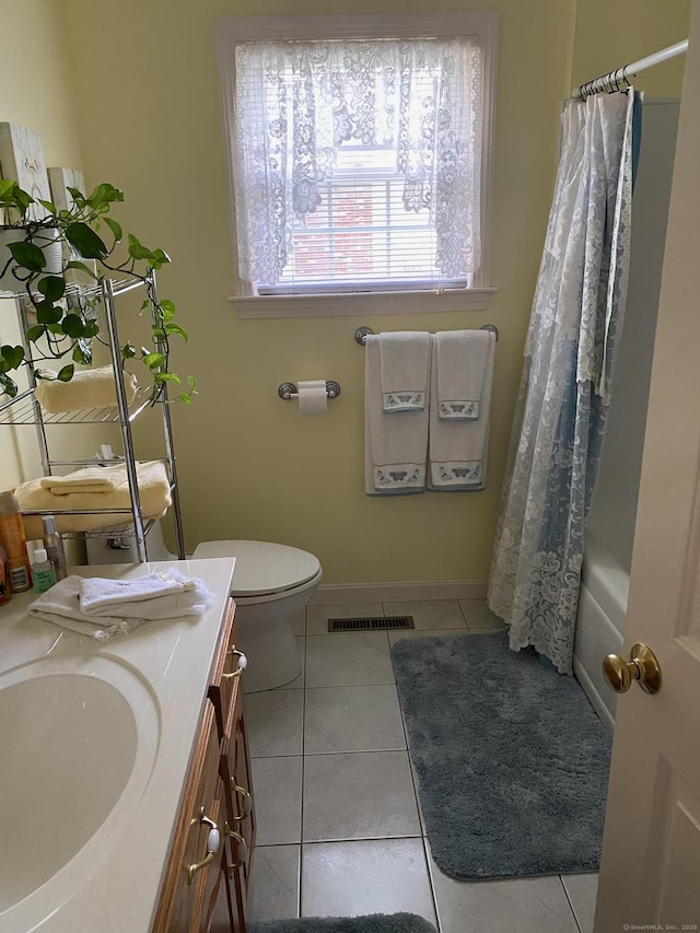 45 Kuhr Dr, Southington, CT 06489 - full bath with vanity, tile patterned floors, toilet, baseboards, and shower / bath combo with shower curtain