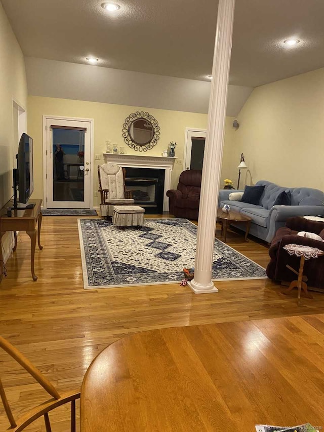 45 Kuhr Dr, Southington, CT 06489 - living room with wood finished floors, decorative columns, recessed lighting, a fireplace, and vaulted ceiling