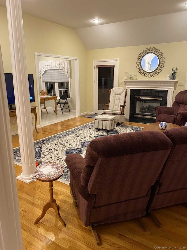 45 Kuhr Dr, Southington, CT 06489 - living area featuring a premium fireplace, vaulted ceiling, wood finished floors, baseboards, and recessed lighting