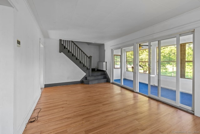 593 Cooke St, Waterbury, CT 06710 - entryway with wood finished floors, stairs, crown molding, a ceiling fan, and baseboards