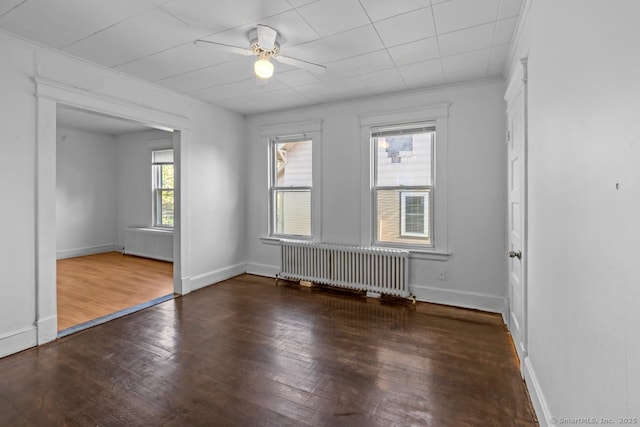593 Cooke St, Waterbury, CT 06710 - unfurnished room with radiator heating unit, wood-type flooring, a ceiling fan, and baseboards