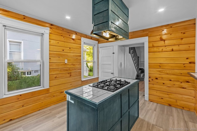 593 Cooke St, Waterbury, CT 06710 - kitchen with tile countertops, gas cooktop, light wood finished floors, wooden walls, and recessed lighting