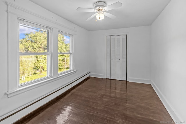 593 Cooke St, Waterbury, CT 06710 - unfurnished bedroom featuring a baseboard heating unit, baseboards, wood finished floors, a closet, and ceiling fan