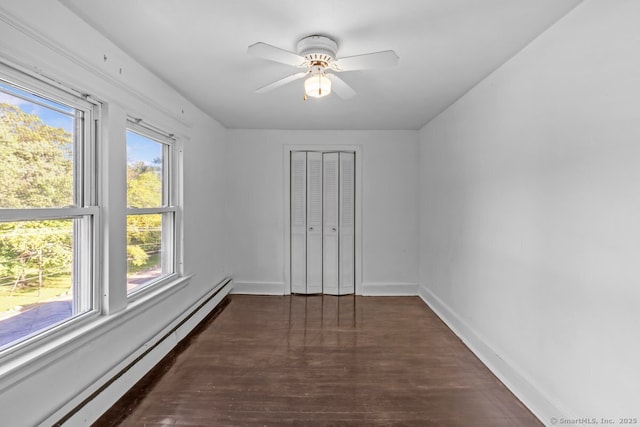 593 Cooke St, Waterbury, CT 06710 - spare room featuring a baseboard heating unit, wood finished floors, a ceiling fan, and baseboards