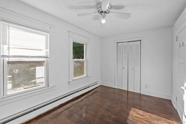593 Cooke St, Waterbury, CT 06710 - unfurnished bedroom with a baseboard heating unit, wood finished floors, a closet, baseboards, and ceiling fan
