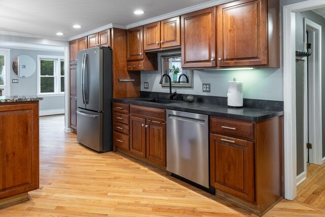 27 Pleasant Valley Rd, Barkhamsted, CT 06063 - kitchen featuring appliances with stainless steel finishes, a sink, light wood-style flooring, crown molding, and brown cabinets