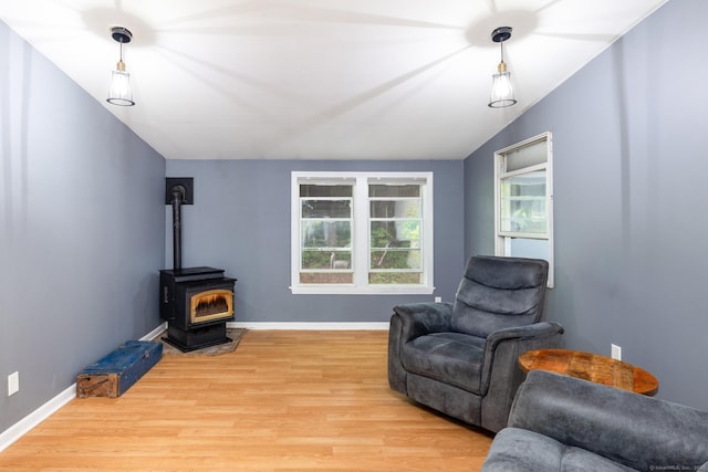 27 Pleasant Valley Rd, Barkhamsted, CT 06063 - sitting room featuring light wood-style flooring, a wood stove, baseboards, and vaulted ceiling