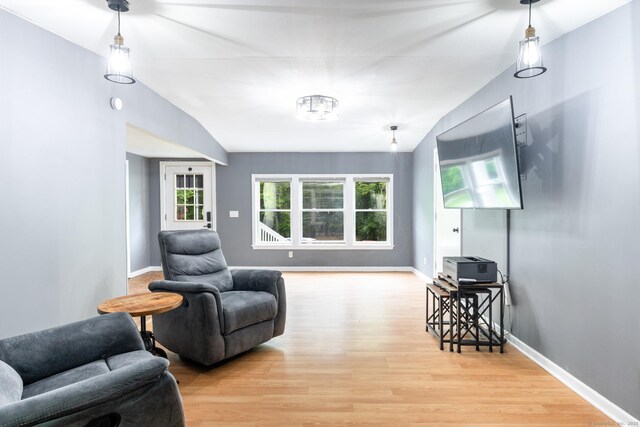 27 Pleasant Valley Rd, Barkhamsted, CT 06063 - living room featuring wood finished floors, healthy amount of natural light, lofted ceiling, and baseboards