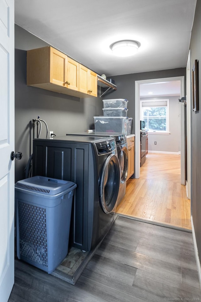 27 Pleasant Valley Rd, Barkhamsted, CT 06063 - laundry room featuring washing machine and dryer, cabinet space, baseboards, and light wood-type flooring
