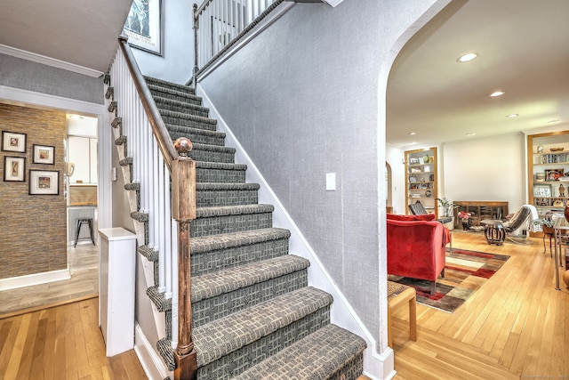 166 Roydon Rd, New Haven, CT 06511 - stairway with hardwood / wood-style flooring, arched walkways, built in features, and recessed lighting