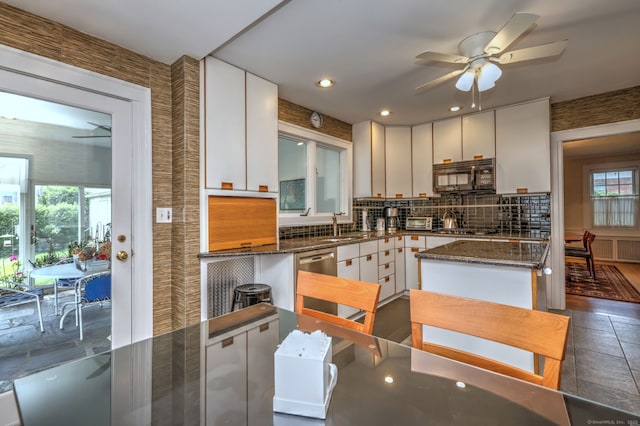 166 Roydon Rd, New Haven, CT 06511 - kitchen featuring appliances with stainless steel finishes, a ceiling fan, backsplash, white cabinets, and dark stone counters