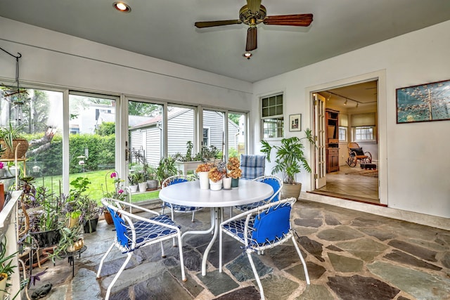 166 Roydon Rd, New Haven, CT 06511 - sunroom with stone flooring, outdoor dining area, and a ceiling fan