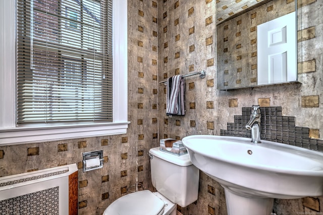 166 Roydon Rd, New Haven, CT 06511 - bathroom with plenty of natural light, tile walls, radiator heating unit, and backsplash