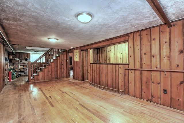 166 Roydon Rd, New Haven, CT 06511 - finished below grade area featuring hardwood / wood-style floors, stairs, and wooden walls