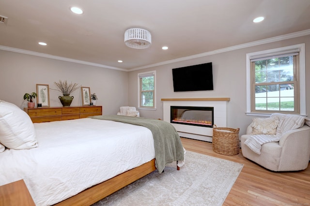 25 Bittersweet Ln, Berlin, CT 06037 - bedroom featuring light wood finished floors, recessed lighting, crown molding, and a glass covered fireplace