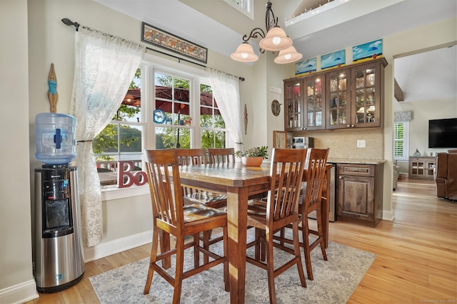 1 Shady Knls, Danbury, CT 06811 - dining area featuring light wood-style floors, plenty of natural light, a chandelier, and baseboards