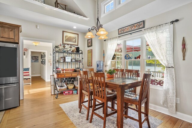1 Shady Knls, Danbury, CT 06811 - dining space with baseboards, light wood finished floors, and a chandelier