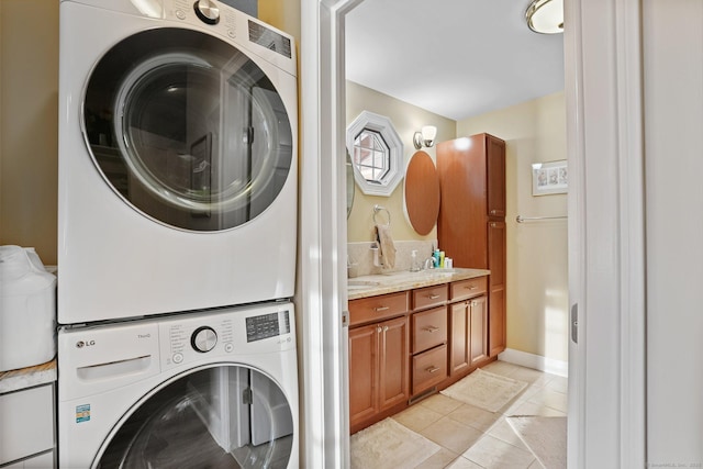 1 Shady Knls, Danbury, CT 06811 - clothes washing area with stacked washing machine and dryer and light tile patterned floors