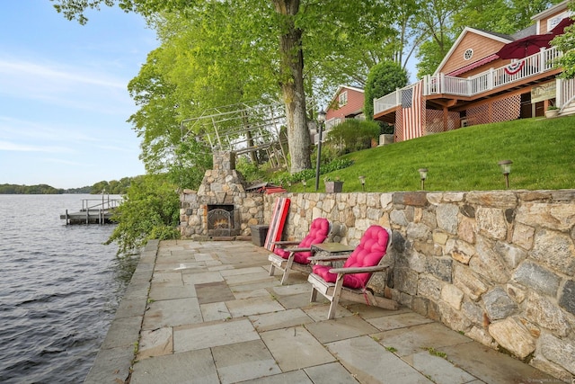 1 Shady Knls, Danbury, CT 06811 - view of patio / terrace with an outdoor stone fireplace, a deck with water view, and a dock