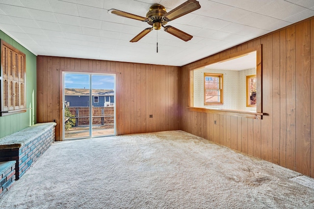 75 W Shore Rd, Ellington, CT 06029 - carpeted spare room featuring wooden walls and ceiling fan