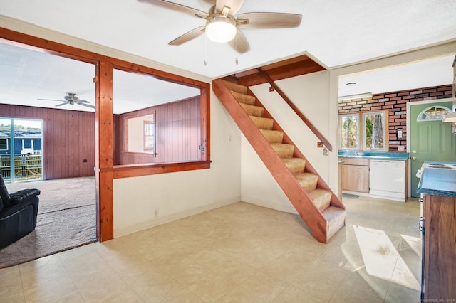 75 W Shore Rd, Ellington, CT 06029 - stairs featuring ceiling fan, healthy amount of natural light, wooden walls, and tile patterned floors