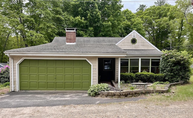 75 W Shore Rd, Ellington, CT 06029 - single story home with a chimney, a shingled roof, asphalt driveway, and a garage