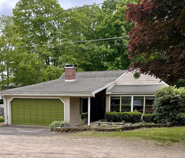 75 W Shore Rd, Ellington, CT 06029 - ranch-style home with a garage, a chimney, a shingled roof, and asphalt driveway