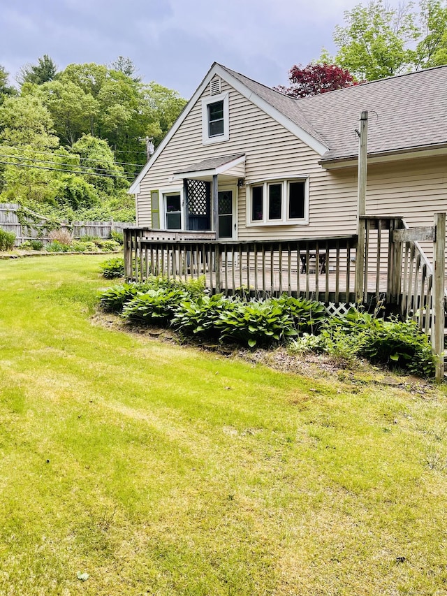 75 W Shore Rd, Ellington, CT 06029 - back of property featuring a deck, a yard, and roof with shingles