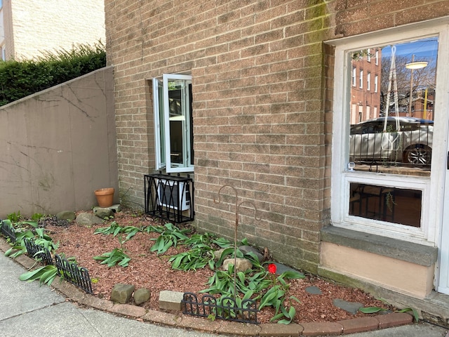 view of property exterior featuring brick siding