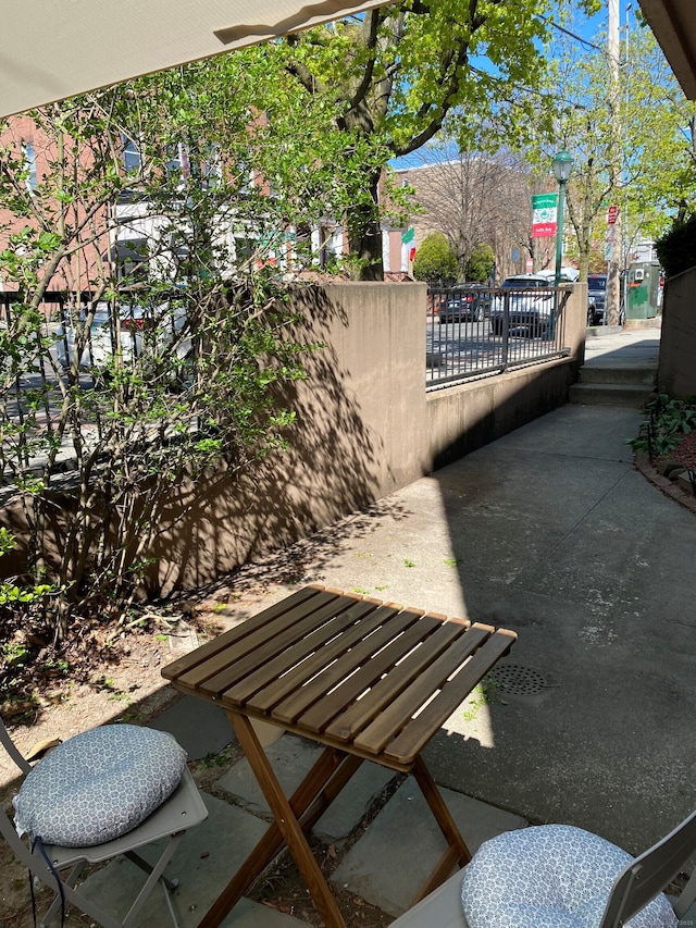view of patio / terrace featuring fence