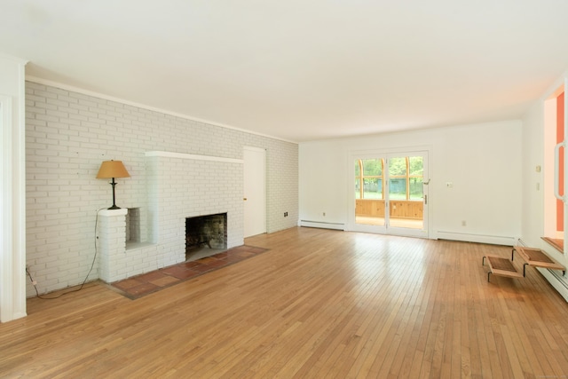 82 Whitethorn Dr, Guilford, CT 06437 - unfurnished living room featuring baseboard heating, light wood-type flooring, a brick fireplace, and brick wall