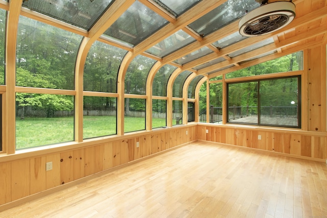 82 Whitethorn Dr, Guilford, CT 06437 - unfurnished sunroom featuring wood-type flooring, wooden walls, and vaulted ceiling