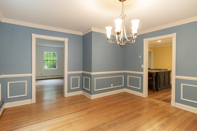 82 Whitethorn Dr, Guilford, CT 06437 - spare room with a baseboard heating unit, light wood-style flooring, a chandelier, crown molding, and baseboards