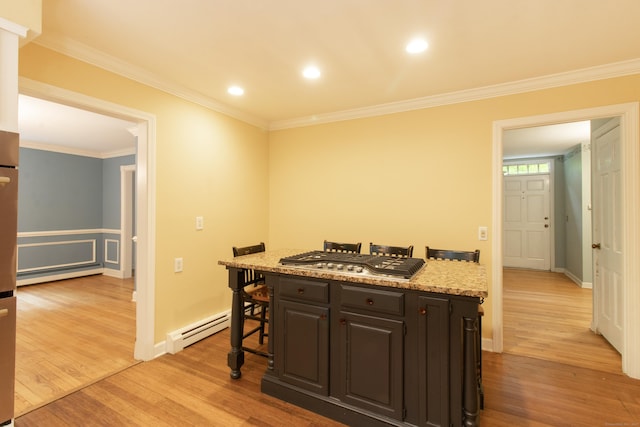82 Whitethorn Dr, Guilford, CT 06437 - kitchen featuring a baseboard heating unit, a breakfast bar, light wood-type flooring, crown molding, and light stone counters