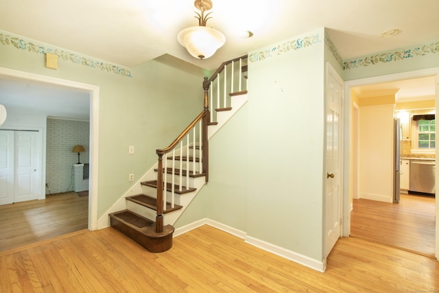 82 Whitethorn Dr, Guilford, CT 06437 - stairs featuring wood finished floors and baseboards