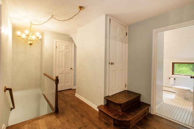 82 Whitethorn Dr, Guilford, CT 06437 - corridor with an upstairs landing, wood finished floors, a chandelier, a baseboard radiator, and baseboards