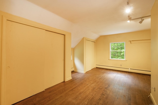 82 Whitethorn Dr, Guilford, CT 06437 - unfurnished bedroom with a baseboard heating unit, wood finished floors, and vaulted ceiling