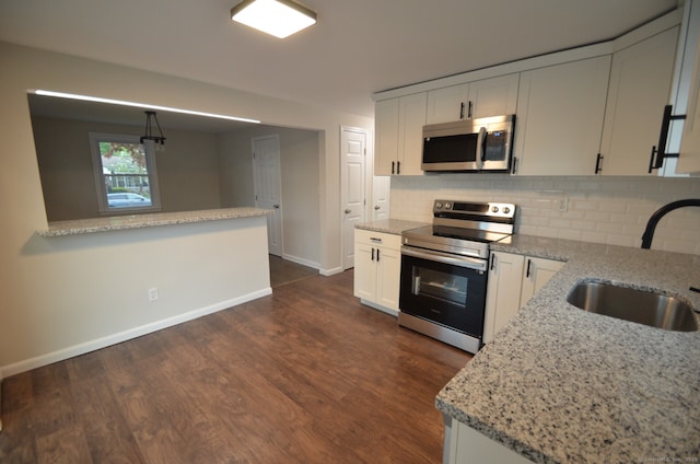 14 Harvest Ln, Bristol, CT 06010 - kitchen featuring stainless steel appliances, a sink, baseboards, and backsplash