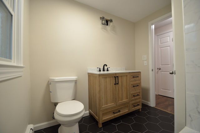 14 Harvest Ln, Bristol, CT 06010 - bathroom with toilet, baseboards, vanity, and tile patterned floors