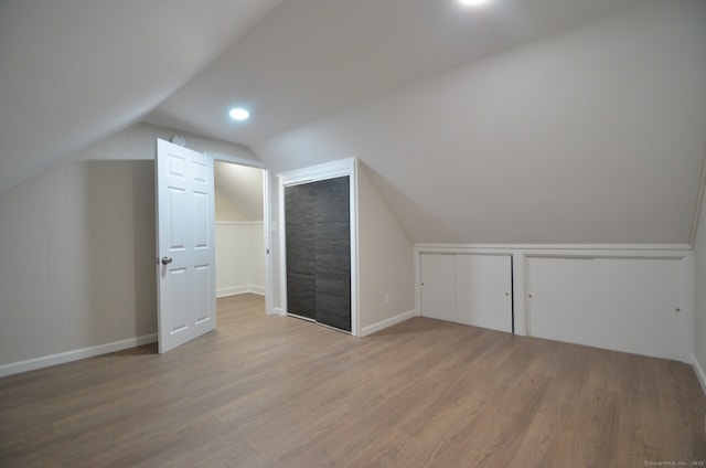 14 Harvest Ln, Bristol, CT 06010 - bonus room with vaulted ceiling, wood finished floors, and baseboards